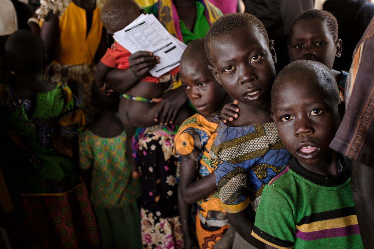 Uganda. South Sudanese refugees queue to register at the Imvepi reception centre