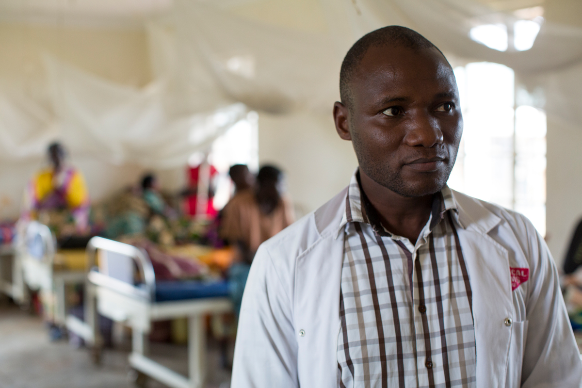 Uganda. Cancer-stricken refugee nurse cares for the sick