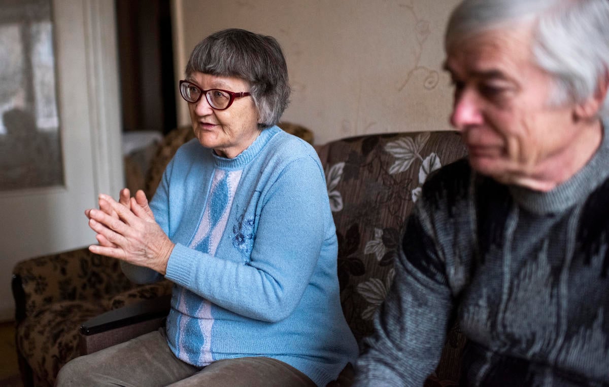 Ukraine. Internally displaced persons sit in the living room of the apartment they are renting on the government-controlled side of the Donbas area and speak about landmine injury