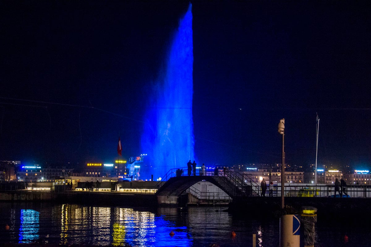 Switzerland. City of Geneva turns the Jet d'Eau blue in honour of the Global Refugee Forum