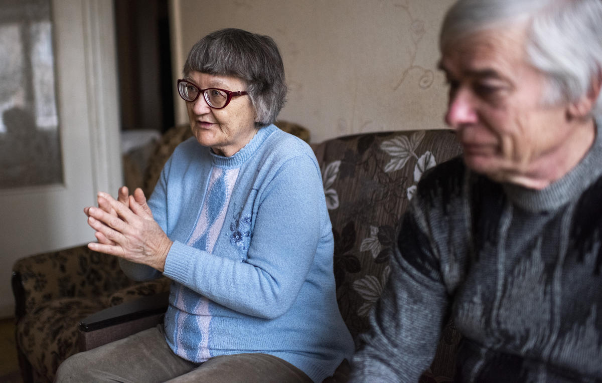 Ukraine. Internally displaced persons sit in the living room of the apartment they are renting on the government-controlled side of the Donbas area and speak about landmine injury