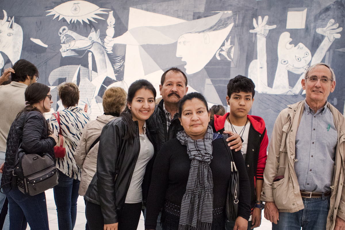 Spain. Colombian refugees and their Spainish mentor in front of Picasso's Guernica at the Reigna Sofia museum in Madrid.