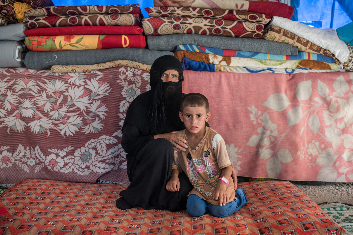 Iraq. People adjusting to life after losing their husbands and fathers.