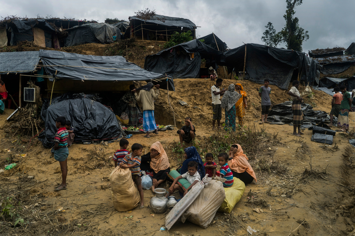 Bangladesh. A Rohingya refugee family searches for shelter