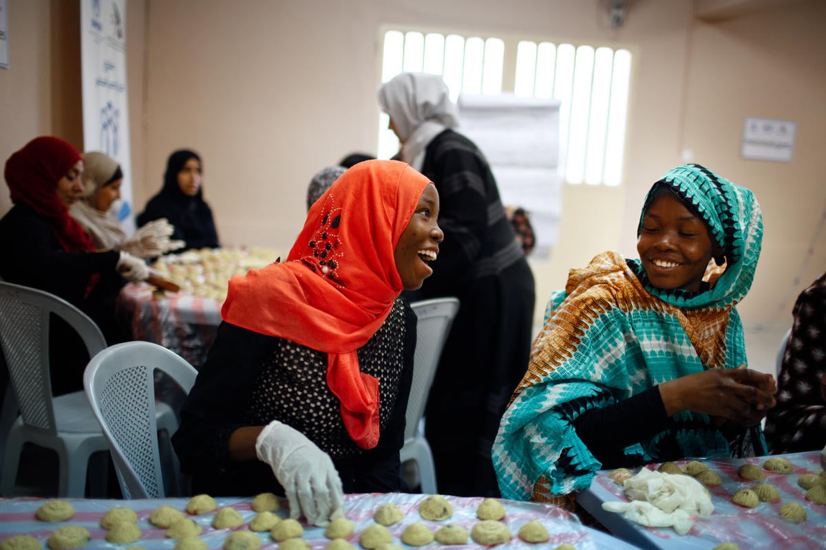 Jordan. A group of refugee women make sweets for Eid and distribute to needy families