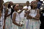 Young refugees from Burundi get ready to dance at the event in Nairobi...