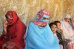 Displaced women and children rest in the dwelling of a host family in ...