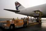 Workers at Luanda's international airport unload UNHCR aid destined fo...