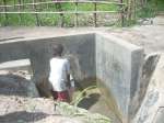A young boy collects water from one of the new water outlets in northe...