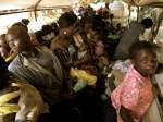 A group of Congolese refugees aboard a bus that took them home earlier...