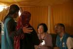 Assistant High Commissioner for Operations Janet Lim listens to the co...