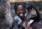 A cheerful young Angolan refugee takes a break from classes in Zambia.