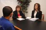 Assistant High Commissioner Erika Feller and a UNHCR staffer meet with...