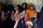A group of refugee women wait to see the doctor in a Bangladeshi camp....