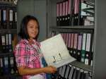 Ah Ywa Paw practises filing in one of the offices in the refugee camp.