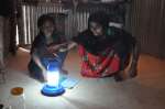 A solar-powered lantern is put to good use in a refugee camp in Bangla...