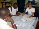 As one member of a census team interviews a refugee, another takes dow...