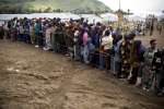 Congolese refugees gather earlier this week for a meeting in Nkamira t...