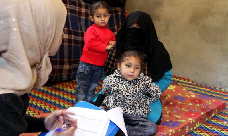 Família síria sendo registrada como refugiados em Halba, no norte do Líbano (UNHCR/F.Juez)