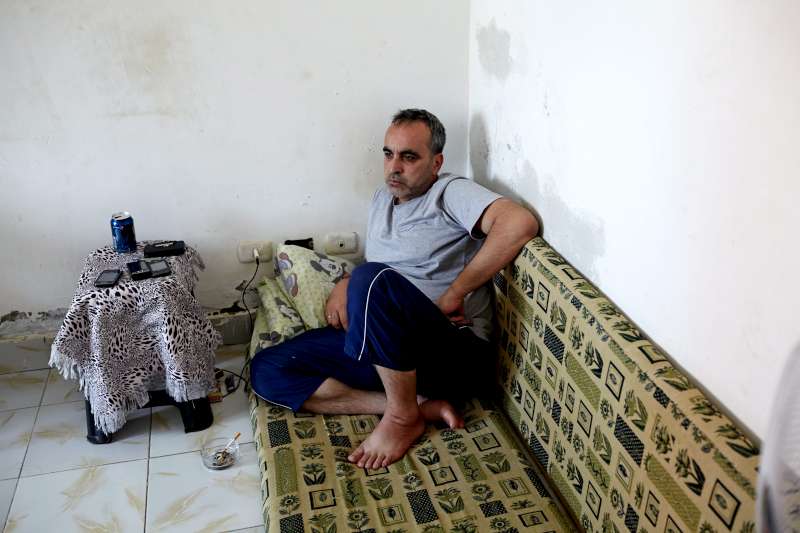 Mohamed, Mahmoud's father, in their home in a satellite city of Cairo. He used to travel the region selling leather goods, but in Egypt he sold bread to his neighbours to try and make ends meet.  