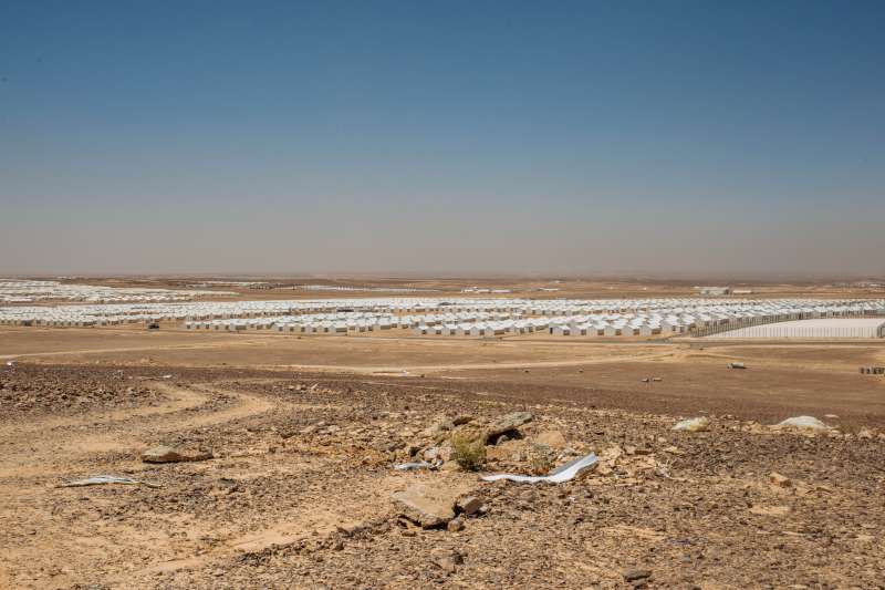 Freshly constructed but still without residents, Azraq spreads out beneath the Jordanian desert sun.