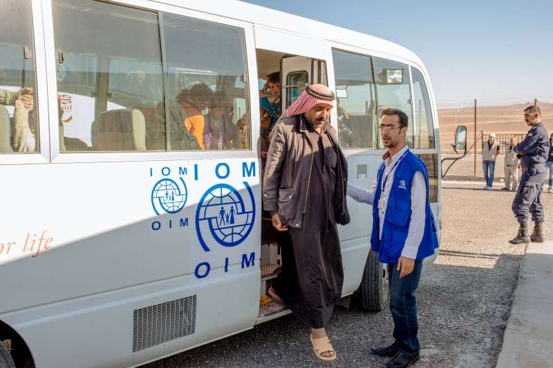 Abu Saleh gets off the bus that has brought him and his family to the new camp at Azraq. The camp was under construction for more than a year.