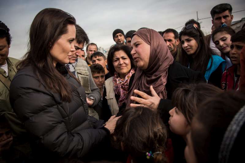 UNHCR Special Envoy Angelina Jolie hears a refugee in Domiz camp tell her harrowing tale of flight.