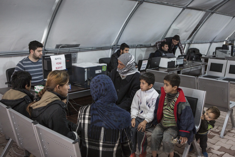 After hours of driving and a week in limbo, Wazzam, Ayesha and their six children register and are assigned a tent at Suruc camp in Turkey.