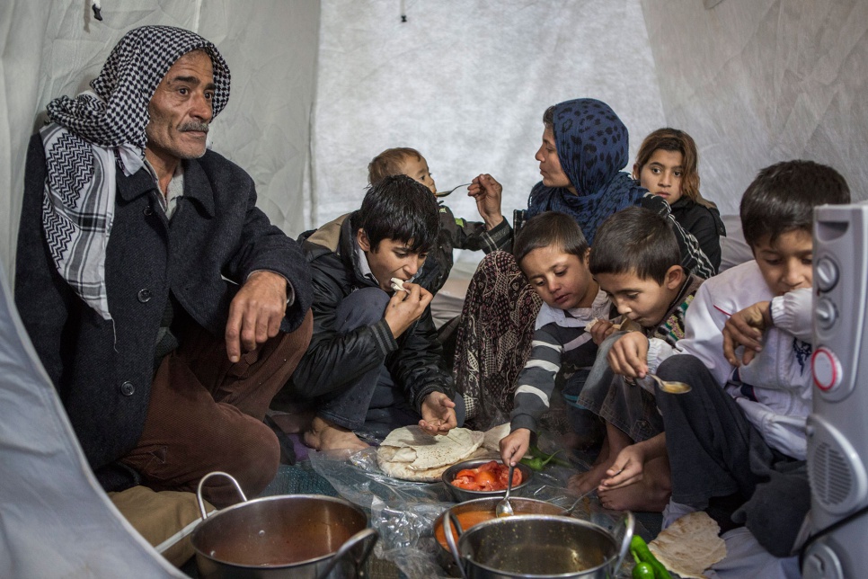Ayesha says she hopes to one day return to Syria, but for now her family has nowhere else to go. Here the family finally rest and have some warm food at the end of a long day.