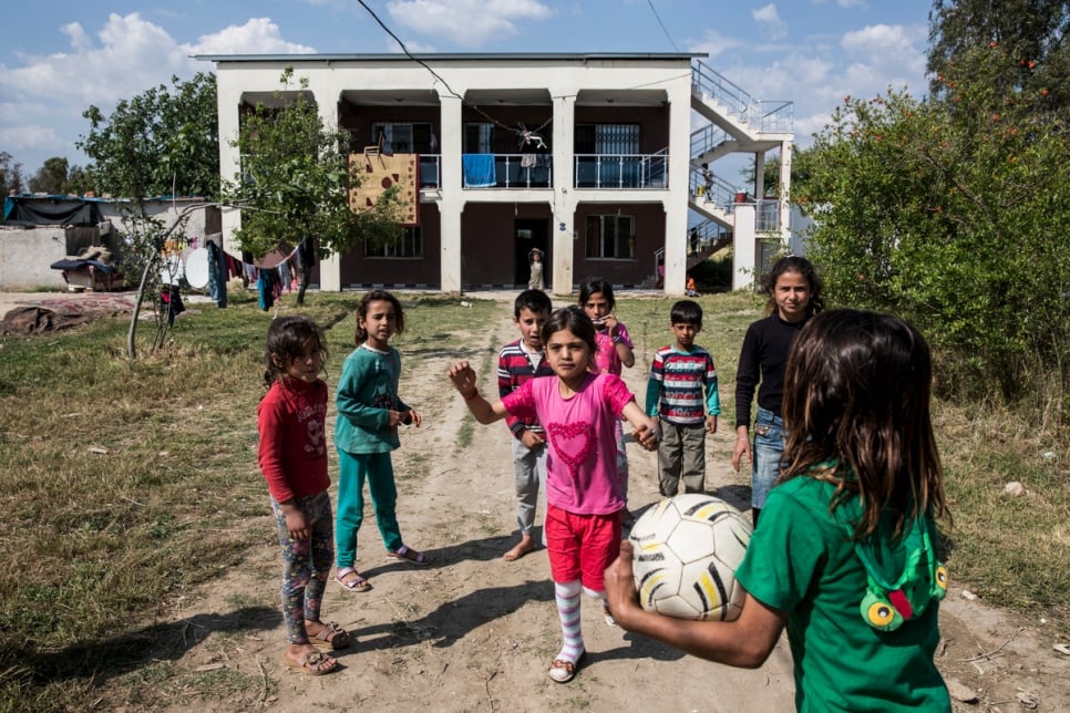Young Syrian refugees play outside their accommodation provided by Levent Topçu, in Torbali, Turkey. 