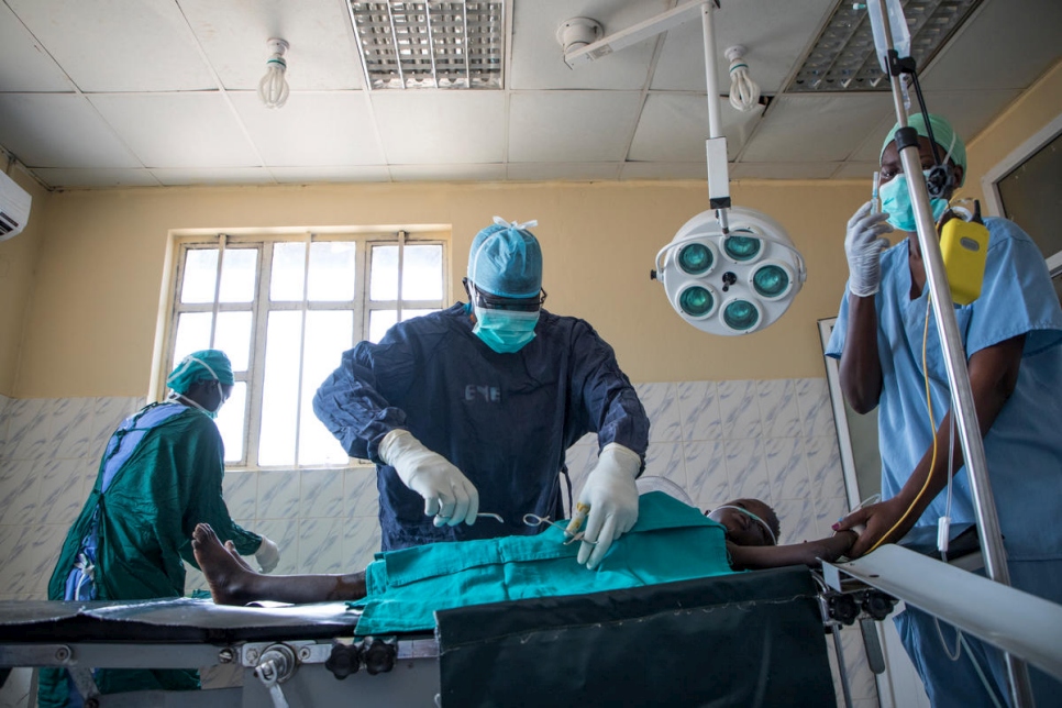 Dr. Evan Atar Adaha operates on a young Sudanese refugee at Bunj Hospital in Maban County, South Sudan. 