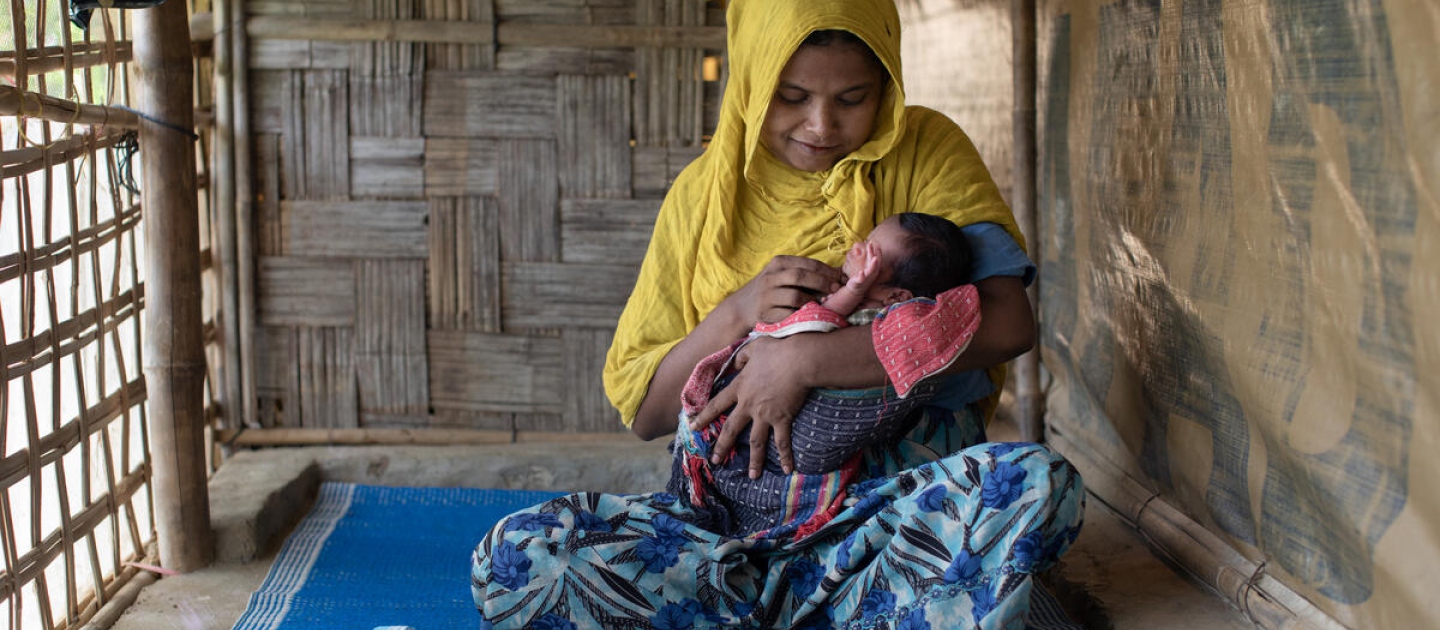 Bangladesh. Community health volunteer helps Rohingya mothers with post-natal care