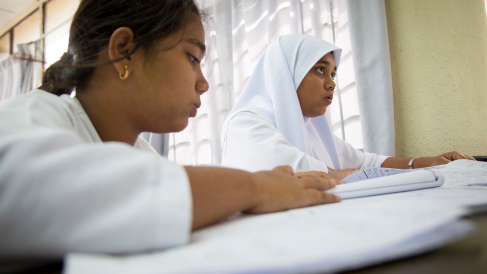 Shamshidah (right) and her 15-year-old sister Yasmin attend class at an informal school for refugees  in Kuala Lumpur, Malaysia.
