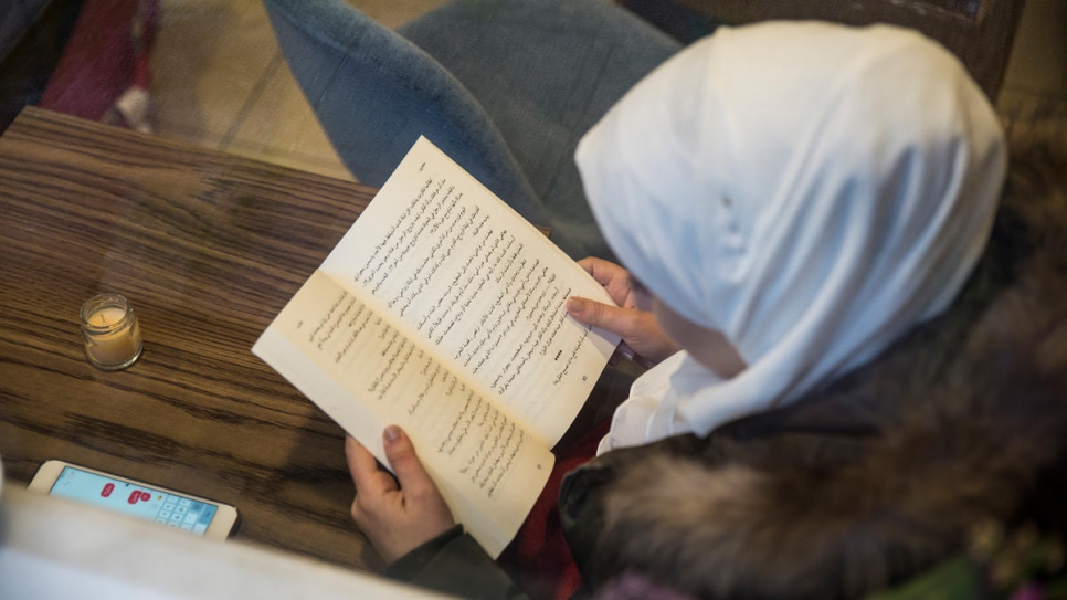 "Syrian people are well educated, they like to read."

A customer reads at the Booka book café in Istanbul, run by 27-year-old Nadia and her fiancé Mohammad.