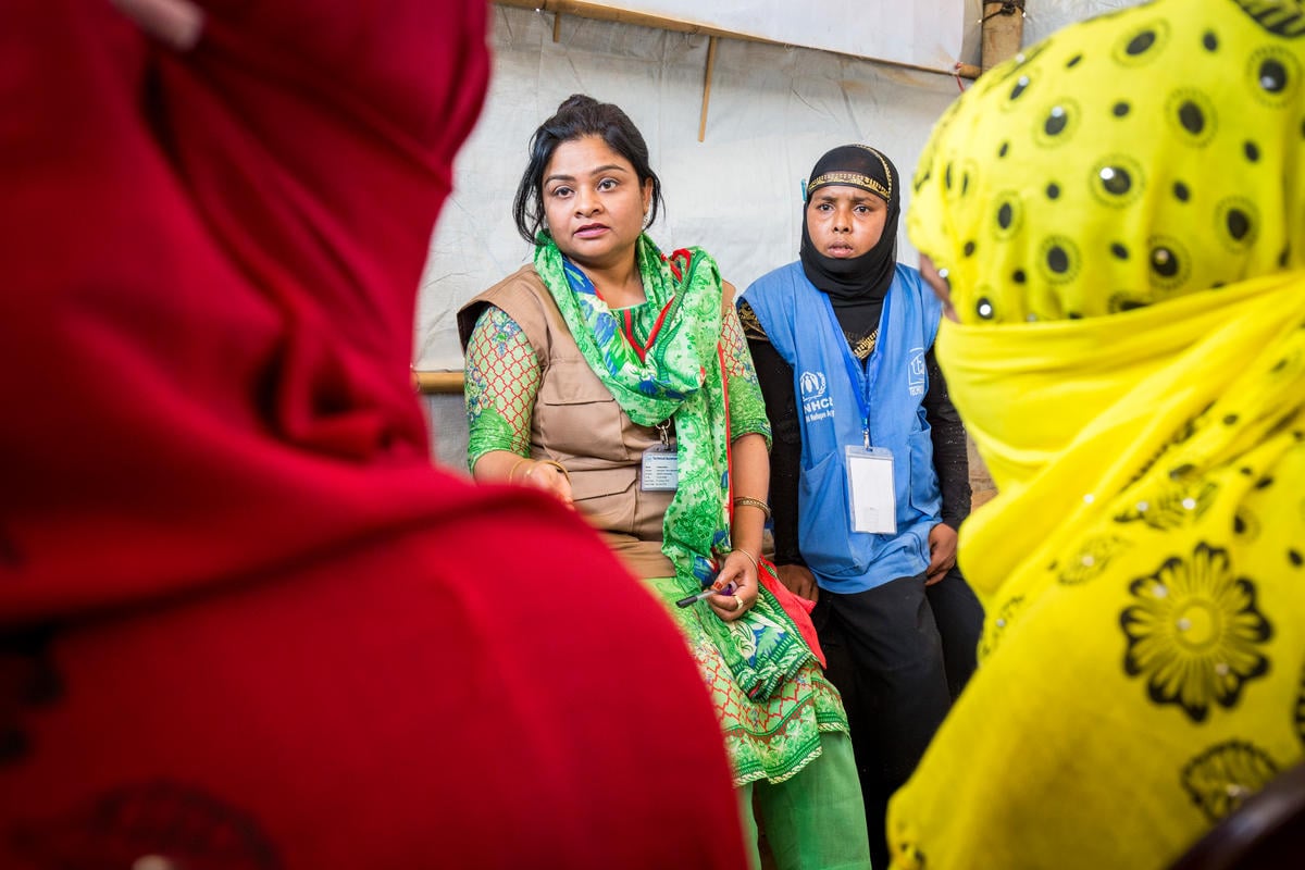 Bangladesh. Female head of households recieve assistance from Community Outreach Volunteers