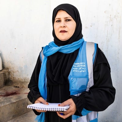 A community outreach volunteer with her notebook