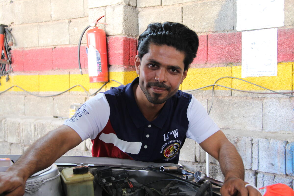 Iran. Afghan refugee at an automobile repair shop supported by UNHCR