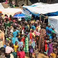 South Sudanese refugee women gather outside a nutrition center in Matar, Gambella, waiting to receive critical assistance. 
