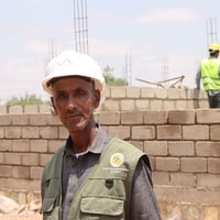 Mohamed at the construction site where he now works as a foreman supervisor.