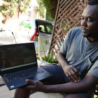 South Africa.  Congolese refugee returns home to rebuild his community with IT skills gained in South Africa