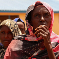 After fleeing conflict in Sudan, Aisha led her daughters and ten grandchildren through the mountains to find safety in South Sudan.