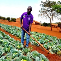 Tanzania. Ephrahim Nyandwi, a teacher and environmental advocate, works in the school garden at Mapendo Secondary School in Nyarugusu Refugee Camp