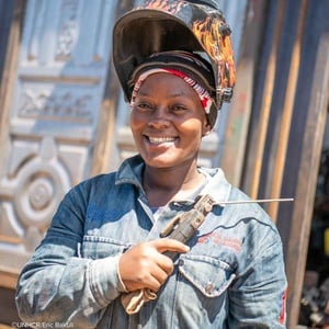 Mariam Suleiman wielding a blowtorch at a workshop in Kakuma. 