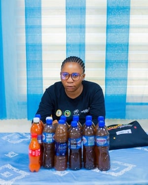 Comfort Oyah, a refugee and entrepreneur from Cameroon, displays her products at the UNHCR-Jobberman career fair in Nigeria. 