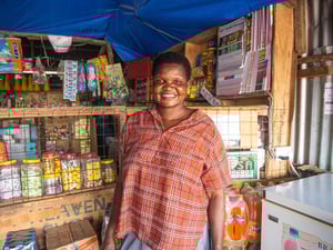 Kavira Generose, a South Sudanese refugee, standing in her shop at the Kalobeyei settlement in Kenya's Kakuma Municipality.