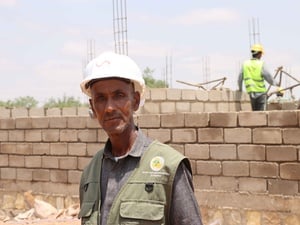 Mohamed at the construction site where he now works as a foreman supervisor.