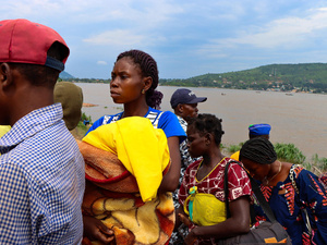 Central African Republic. As the river convoy arrives at Bangui's Port Amont, Micheline disembarks with several other Central Africans returnees