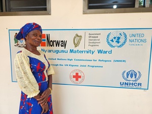 Rehema, a Congolese refugee and a community leader in Tanzania's Nyarugusu refugee camp stands by a new maternity ward in the settlement, thanks to her advocacy efforts.