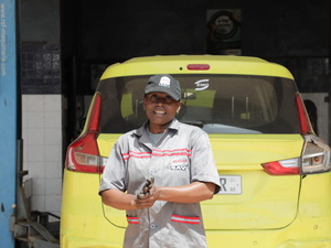 Senegal. Dakar, Senegal - Marie Etah at her place of work Eminence Motors Garage (EMG)