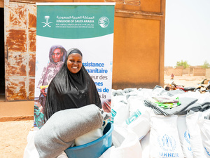 Burkina Faso. Odile Ouédraogo, an Internally Displaced Person (IDP), receives a core relief kit in the Yaadga region